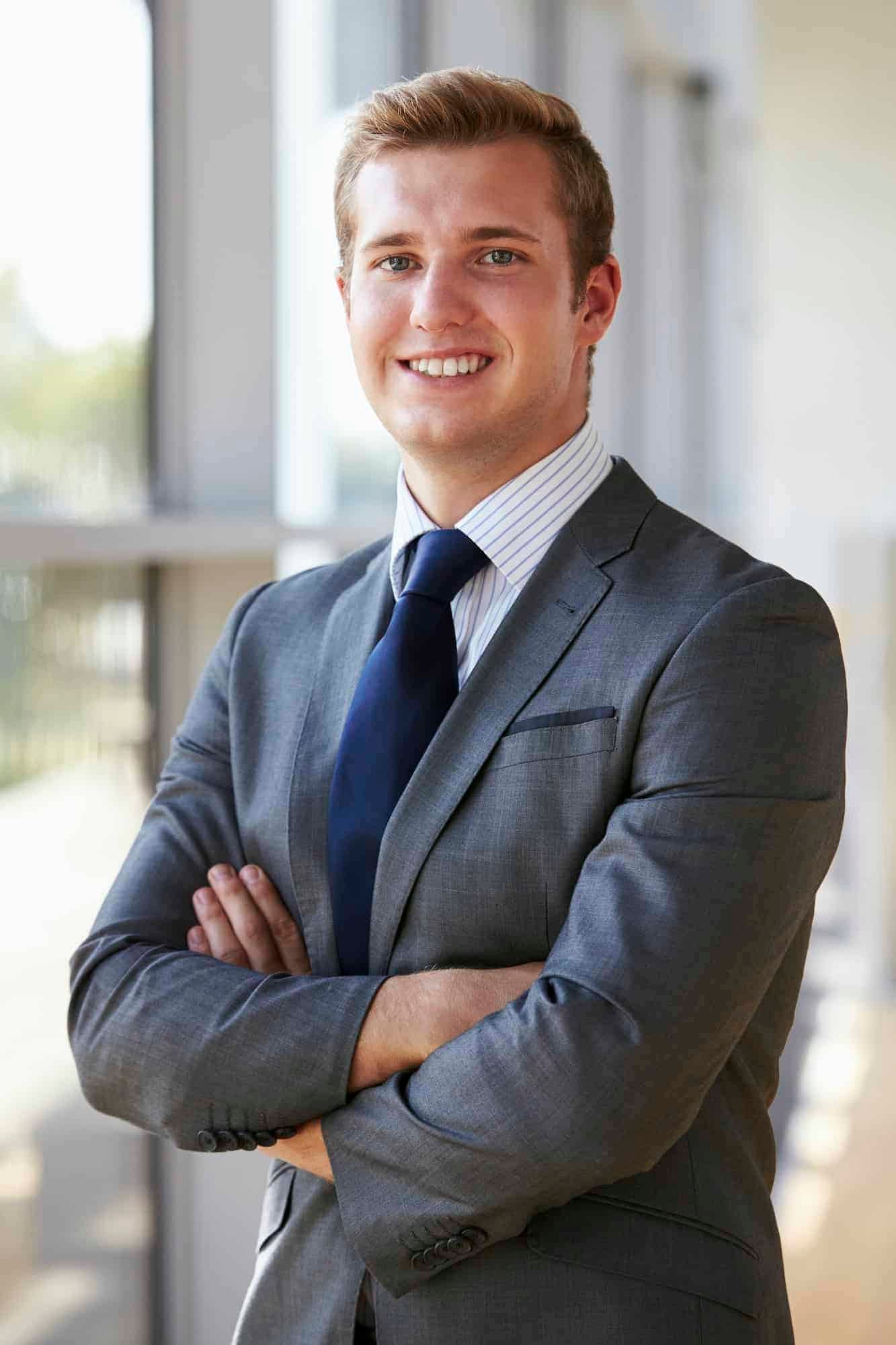 Team Inwisdoo -Harri Cooper - portrait-of-a-young-smiling-professional-man-arms-crossed